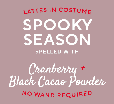 Lattes in costume: Spooky Season, spelled with Cranberry Powder and Black Cacao Powder, no wand required