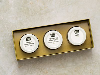 Italian seasoning, herbes de provence, and basil pinch jars in a gold gift box